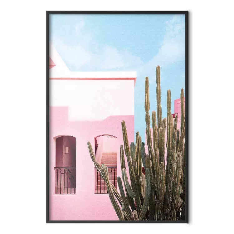 Miami-kaktus - rosa semesterhus mot blå himmel och ljus