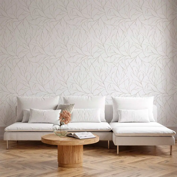 Minimalism - ljusbeige grenar sammanflätade med varandra på en vit bakgrund
