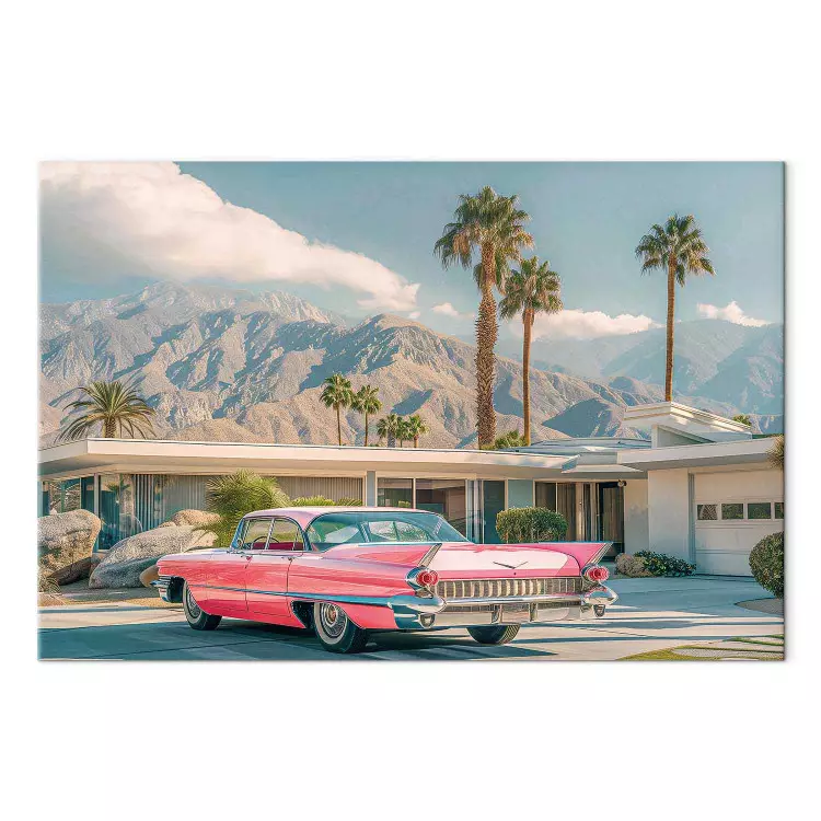 Retro Cadillac - klassisk bil mot en bakgrund av berg och palmer