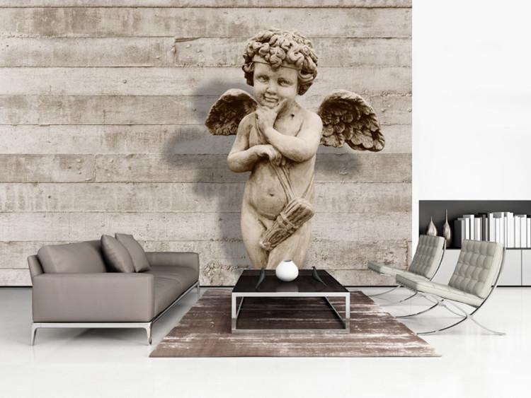 Fototapet Cherub - skulptur av förtjusande ängel på betongbakgrund i retrostil