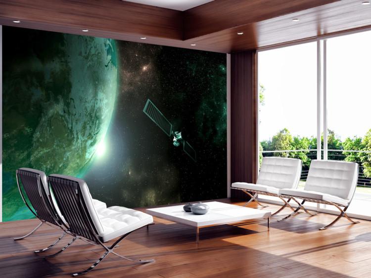 Fototapet Universum - rymdscape med stjärnor, grön jord och en satellit