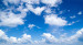 Fototapet Under bar himmel - landskap med blå himmel och ljusa moln 59851